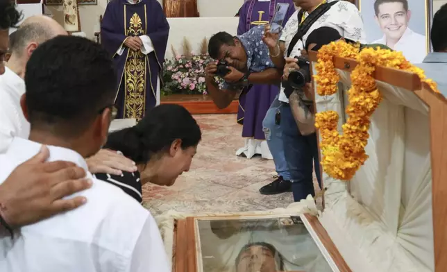 Relatives of slain Mayor Alejandro Arcos cry during his funeral service, one week after he took office, in Chilpancingo, Guerrero state, Mexico, Monday, Oct. 7, 2024. (AP Photo/Alejandrino Gonzalez)