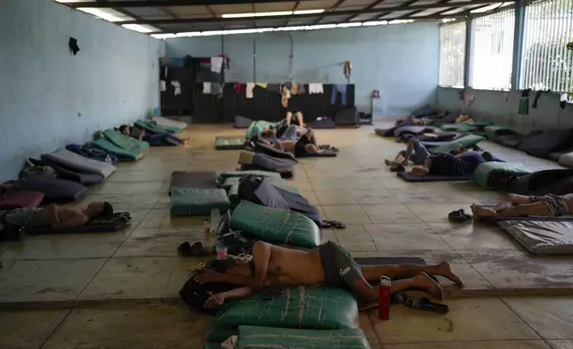 Honduran migrant Elvin Cruz rests on a mat in a shelter in Tapachula, Mexico, Monday, Oct. 28, 2024. (AP Photo/Matias Delacroix)