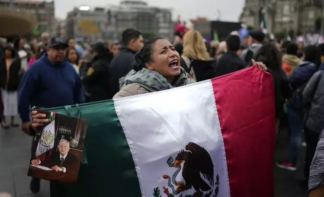 Supporters of Mexican President Andres Manuel Lopez Obrador gather outside the National Palace where he holds his last morning press conference, "La Mañanera," in Mexico City, Monday, Sept. 30, 2024. (AP Photo/Eduardo Verdugo)