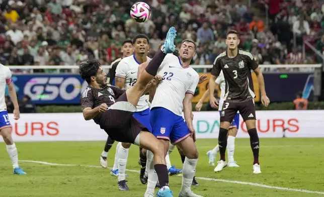 Mexico's Raúl Jiménez, left, kicks the ball past the United States' Joe Scally during an international friendly soccer match at Akron Stadium in Guadalajara, Mexico, Tuesday, Oct. 15, 2024. (AP Photo/Eduardo Verdugo)