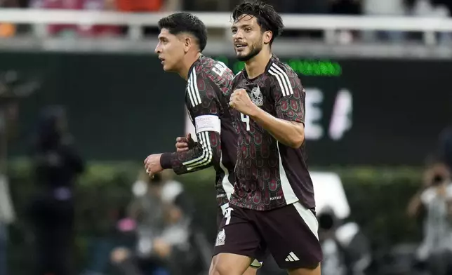 Mexico's Raúl Jiménez, right, celebrates scoring his side's opening goal against the United States during an international friendly soccer match at Akron Stadium in Guadalajara, Mexico, Tuesday, Oct. 15, 2024. (AP Photo/Eduardo Verdugo)