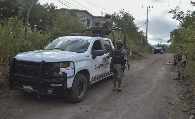 National Guards patrol a street in Culiacan, Sinaloa state, Mexico, Monday, Oct. 14, 2024. (AP Photo)