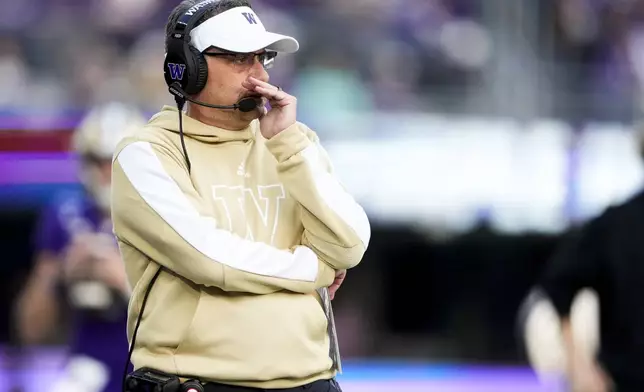 Washington head coach Jedd Fisch stands on the sideline during the first half of an NCAA college football game against Michigan, Saturday, Oct. 5, 2024, in Seattle. (AP Photo/Lindsey Wasson)