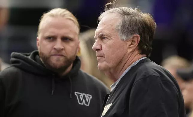 Former New England Patriots head coach Bill Belichick, right, stands with son and Washington defensive coordinator Steve Belichick, left, before an NCAA college football game against Michigan, Saturday, Oct. 5, 2024, in Seattle. (AP Photo/Lindsey Wasson)