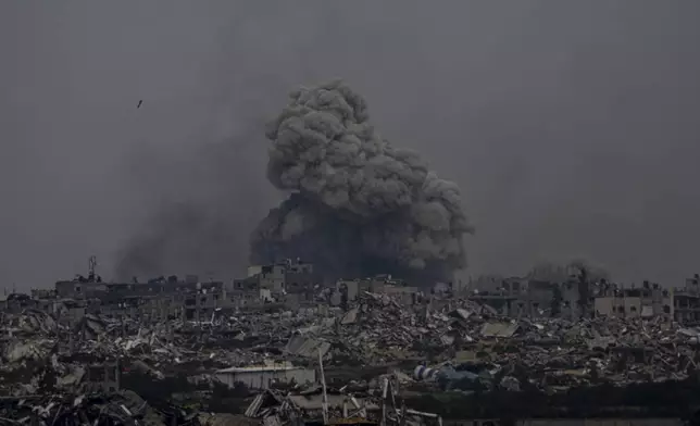 FILE - Smoke and explosions rise inside the Gaza Strip, as seen from southern Israel, Sunday, Sunday, March 17, 2024. (AP Photo/Ariel Schalit, File)