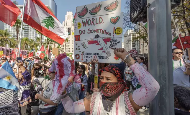 People participate in a rally in support of the Palestinian people downtown Los Angeles on Saturday, Oct. 5, 2024, two days before the anniversary of Hamas-led groups' attack in Israeli territory outside of Gaza on Oct. 7, 2023. (AP Photo/Damian Dovarganes)