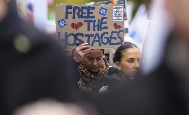 People attend a demonstration in support of Israel to mark the first anniversary of the Hamas attack on Israel, in Berlin, Germany, Sunday, Oct. 6, 2024. (AP Photo/Markus Schreiber)