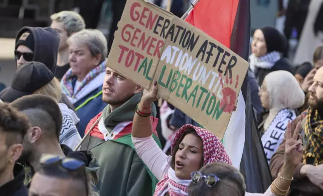 People demonstrate in support of Palestinians in Hamburg, Germany, Saturday, Oct. 5, 2024. (Georg Wendt/dpa via AP)