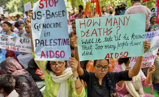 Protesters hold placards during a protest against Israel as they appeal for immediate ceasefire in Gaza, in New Delhi, India, Monday, Oct. 7, 2024. (AP Photo)