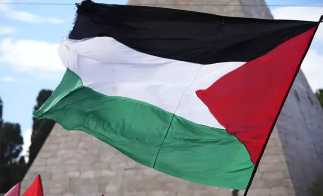 Palestinian flag is seen during a protest in Rome, Saturday, Oct. 5, 2024. Pro-palestinians people take to the street in an unauthorised march in the centre of Rome two days ahead of the first anniversary of the Oct. 7. (AP Photo/Andrew Medichini)