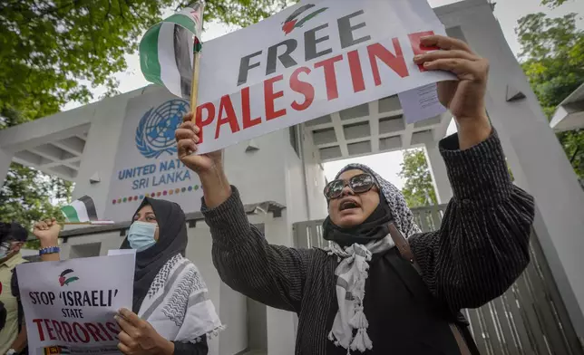 Civil society members shout slogans during a protest against Israel outside the UN office in Colombo, Sri Lanka, Monday, Oct. 7, 2024. (AP Photo/Eranga Jayawardena)