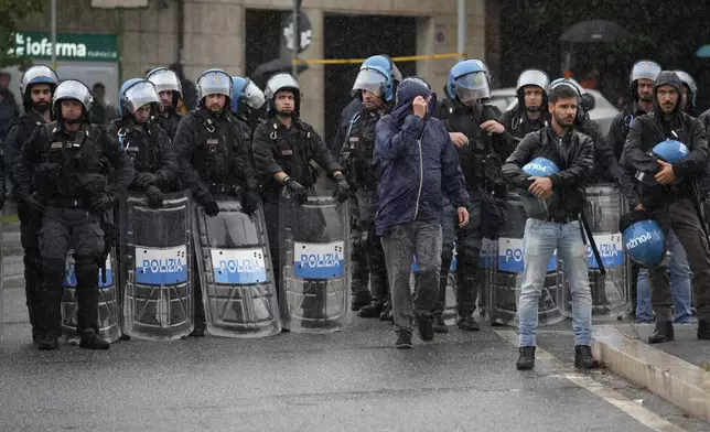 Italian Police officers patrol during a protest in Rome, Saturday, Oct. 5, 2024. Pro-palestinians people take to the street in an unauthorised march in the centre of Rome two days ahead of the first anniversary of the Oct. 7. (AP Photo/Andrew Medichini)