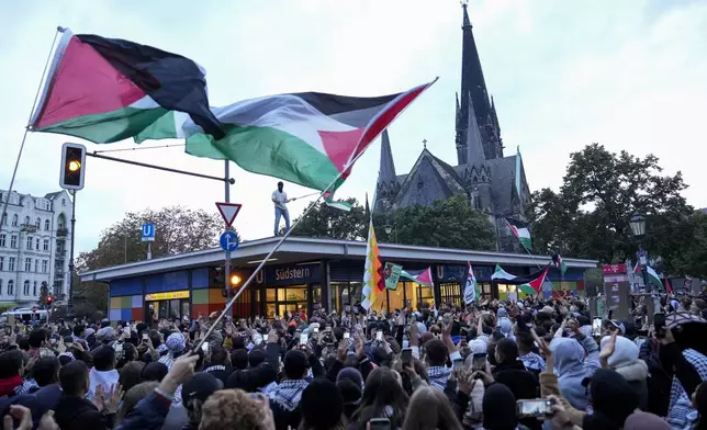 People take part in a pro-Palestinian rally in Berlin, Monday, Oct. 7, 2024. (AP Photo/Ebrahim Noroozi)