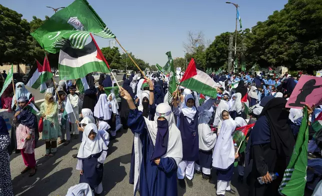 School children take part in a rally organized by Pakistan Markazi Muslim League party, to protest against Israeli airstrikes and to show solidarity with Palestinian people living in Gaza and Lebanon, in Karachi, Pakistan, Monday, Oct. 7, 2024. (AP Photo/Fareed Khan)