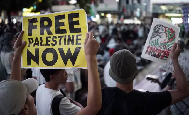 Protesters demonstrate against Israel as they appeal for immediate ceasefire in Gaza, during a rally, Monday, Oct. 7, 2024 near the Shibuya pedestrian crossing in Tokyo. (AP Photo/Eugene Hoshiko)