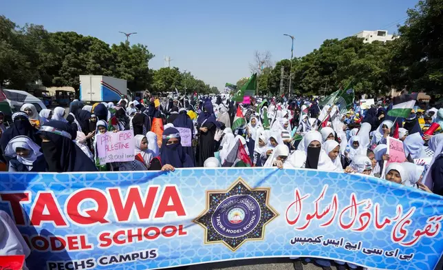 School children take part in a rally organized by Pakistan Markazi Muslim League party, to protest against Israeli airstrikes and to show solidarity with Palestinian people living in Gaza and Lebanon, in Karachi, Pakistan, Monday, Oct. 7, 2024. (AP Photo/Fareed Khan)