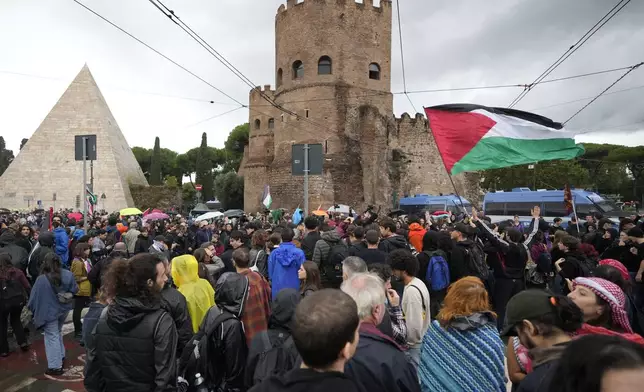 People attend at a protest in Rome, Saturday, Oct. 5, 2024. Pro-palestinians people take to the street in an unauthorised march in the centre of Rome two days ahead of the first anniversary of the Oct. 7. (AP Photo/Andrew Medichini)