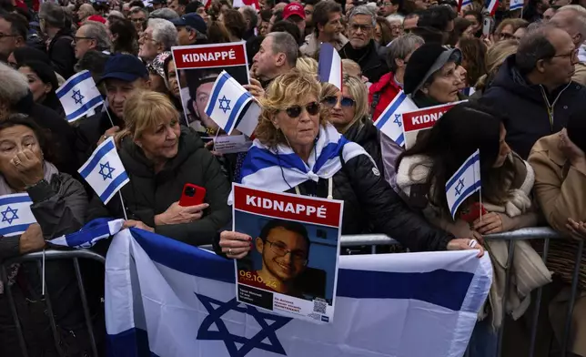 People attend a demonstration in support of Israel to mark the first anniversary of the Hamas attack on Israel, in Paris, Sunday, Oct. 6, 2024.(AP Photo/Louise Delmotte)