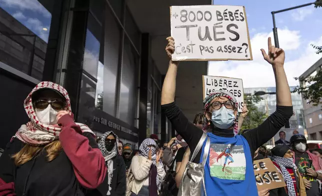 Attendees react during a pro-Palestinian demonstration on the anniversary of a Hamas attack on Israel that triggered the ongoing war in Gaza in front of Concordia University in Montreal, Canada, Monday, Oct. 7, 2024. (Christinne Muschi/The Canadian Press via AP)