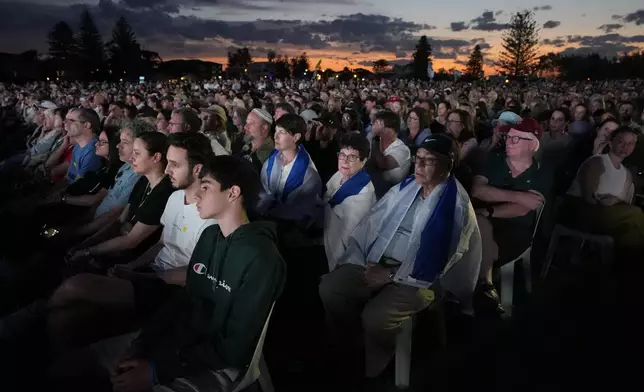 Members of the Jewish community gather at a park in Sydney, Australia, on Monday, Oct. 7, 2024, as mourners marked the anniversary of the Oct. 7, 2023, Hamas attack. (AP Photo/Rick Rycroft)