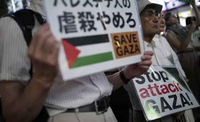 Protesters demonstrate against Israel as they appeal for immediate ceasefire in Gaza, during a rally, Monday, Oct. 7, 2024 near the Shibuya pedestrian crossing in Tokyo. (AP Photo/Eugene Hoshiko)