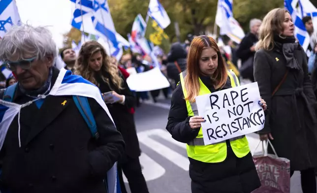 People attend a demonstration in support of Israel to mark the first anniversary of the Hamas attack on Israel, in Berlin, Germany, Sunday, Oct. 6, 2024. (AP Photo/Markus Schreiber)