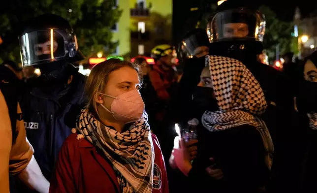 Activist Greta Thunberg, left, attends a pro-Palestinian rally in Berlin, Monday, Oct. 7, 2024. (AP Photo/Ebrahim Noroozi)