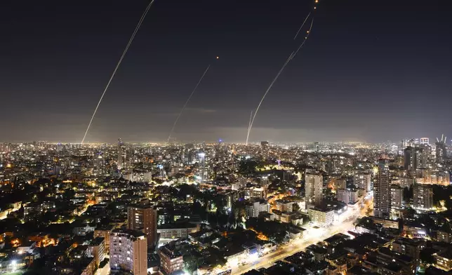 Israeli Iron Dome air defense system fires to intercept a rocket fired from the Gaza Strip, in central Israel, Sunday, Nov. 5, 2023. (AP Photo/Oded Balilty)