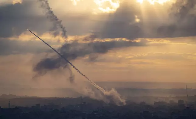 Rockets are fired toward Israel from Gaza, Saturday, Oct. 7, 2023. (AP Photo/Fatima Shbair)