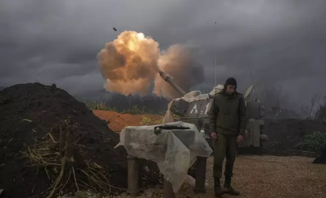 An Israeli mobile artillery unit fires a shell from northern Israel toward Lebanon, Thursday, Jan. 11, 2024. (AP Photo/Leo Correa)