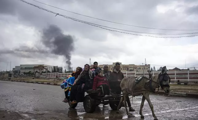 Palestinians flee from the city of Khan Younis in southern Gaza after an Israeli ground and air offensive on Monday, Jan. 29, 2024. (AP Photo/Fatima Shbair)