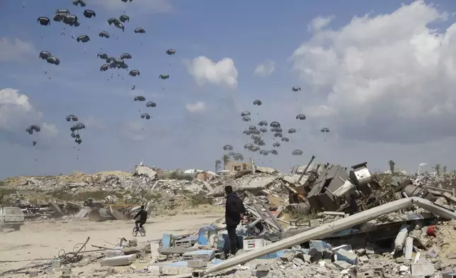 Humanitarian aid is airdropped to Palestinians over Gaza City, Gaza Strip, Monday, March 25, 2024. (AP Photo/Mahmoud Essa)