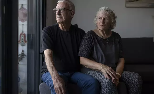 Shlomo Margalit and his wife, Hanna’le Margalit, talk about the Oct. 7, 2023, Hamas attack on Kibbutz Nir Oz during an interview in their temporary home in Kiryat Gat, Israel, Sunday, Sept. 22, 2024. (AP Photo/Leo Correa)