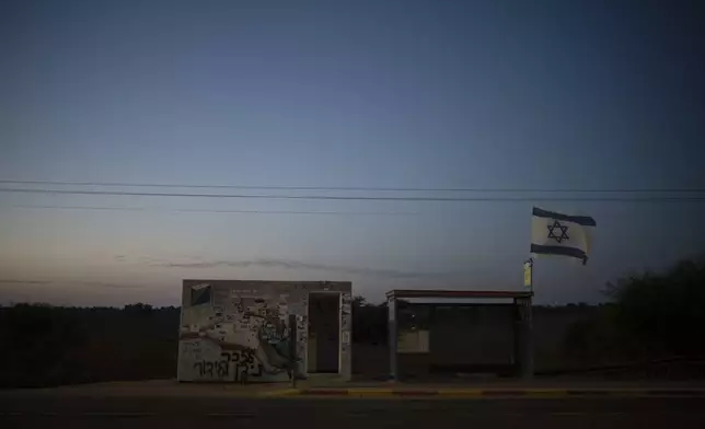 The roadside bomb shelter where Ziv Abud survived, protected by the crush of bodies above her, during the attack by Hamas militants on Oct. 7, 2023, is seen at dusk near Kibbutz Reim, southern Israel, Wednesday, Sept. 11, 2024. (AP Photo/Leo Correa)