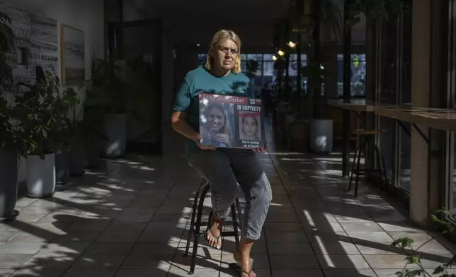 Simona Steinbrecher, whose daughter, Doron Steinbrecher, was kidnapped by Hamas militants on Oct. 7, from Kibbutz Kfar Aza poses for a portrait in Kibbutz Shefayim, Israel, Sunday, Sept. 23, 2024. (AP Photo/Ohad Zwigenberg)