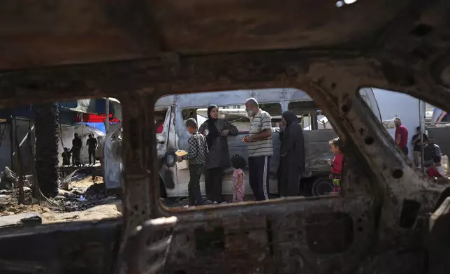 The site of a deadly fire, after an Israeli strike hit a tent area in the courtyard of Al Aqsa Martyrs hospital in Deir al-Balah, Gaza Strip, Wednesday, Oct. 16, 2024. (AP Photo/Abdel Kareem Hana)