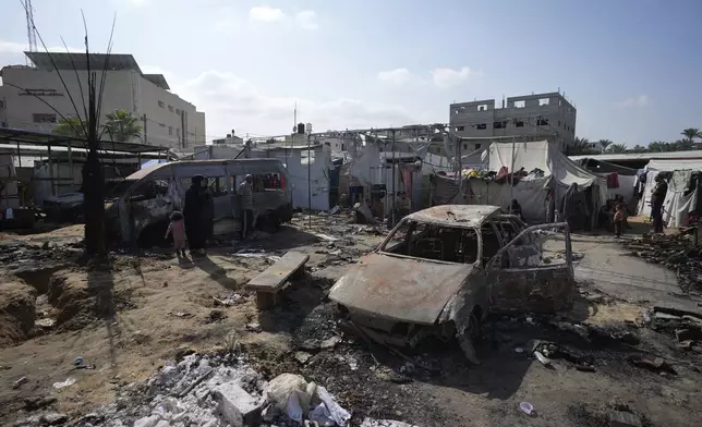 The site of a deadly fire, after an Israeli strike hit a tent area in the courtyard of Al Aqsa Martyrs hospital in Deir al-Balah, Gaza Strip, Wednesday, Oct. 16, 2024. (AP Photo/Abdel Kareem Hana)