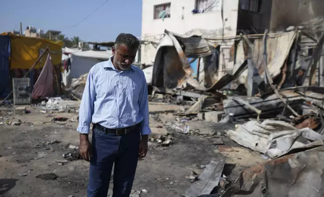 Abdel-Hayy Shaban al-Dalu, at the site where his nephew, Shaban, was killed in a fire after an Israeli strike hit a tent area in the courtyard of Al Aqsa Martyrs hospital in Deir al-Balah, Gaza Strip, Wednesday, Oct. 16, 2024. (AP Photo/Abdel Kareem Hana)