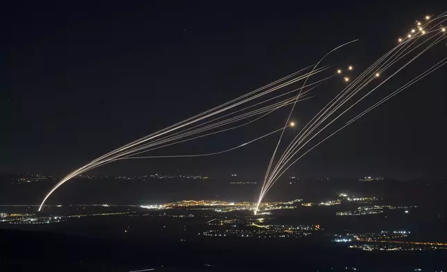 FILE - The Israeli Iron Dome air defense system fires to intercept an attack from Lebanon over the Galilee region as seen from the Israeli-annexed Golan Heights, on Aug. 4, 2024. (AP Photo/Leo Correa, File)