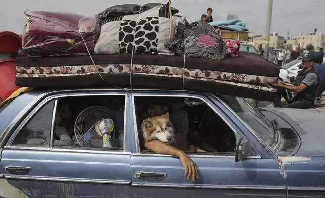 FILE - Palestinians flee from the southern Gaza city of Rafah during an Israeli ground and air offensive in the city on Tuesday, May 28, 2024. (AP Photo/Jehad Alshrafi, File)