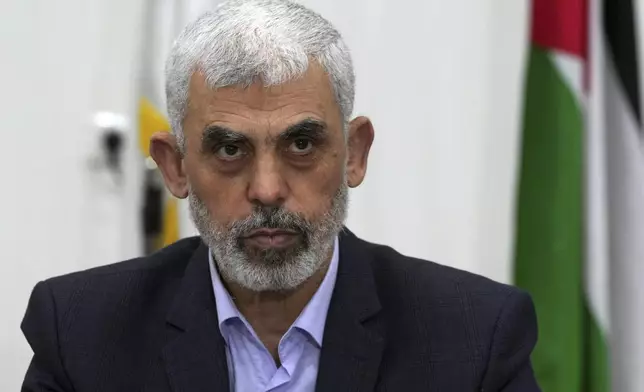 FILE - Yahya Sinwar, head of Hamas in Gaza, chairs a meeting with leaders of Palestinian factions at his office in Gaza City, on April 13, 2022. (AP Photo/Adel Hana, File)