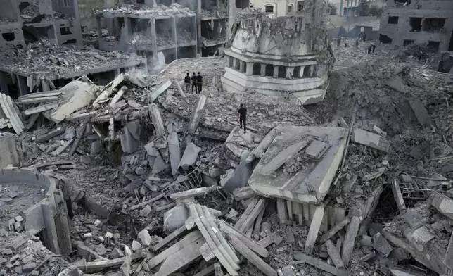 FILE - Palestinians inspect the rubble of the Yassin Mosque destroyed after it was hit by an Israeli airstrike at Shati refugee camp in Gaza City, on Oct. 9, 2023. (AP Photo/Adel Hana, File)