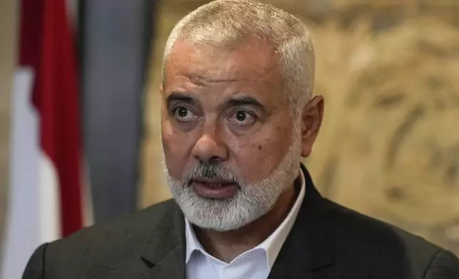 FILE - Ismail Haniyeh, leader of the Palestinian militant group Hamas, speaks to journalists after his meeting with Lebanese Parliament Speaker Nabih Berri, in Beirut, Lebanon, June 28, 2021. (AP Photo/Hassan Ammar, File)