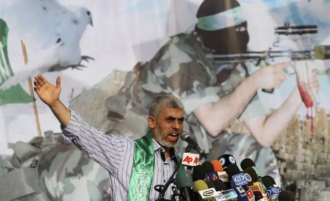 File - In this Oct. 21, 2011, file photo, Yahya Sinwar, a founder of Hamas' military wing, talks during a rally in Khan Younis, southern Gaza Strip. (AP Photo/Hatem Moussa, File)