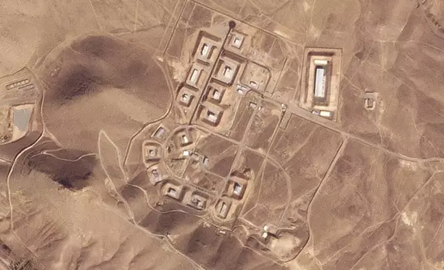 This satellite photo from Planet Labs PBC shows damaged buildings at Iran's Khojir military base outside of Tehran, Iran, Saturday, Oct. 26, 2024. An Israeli attack on Iran damaged facilities at a secretive military base southeast of the Iranian capital that experts in the past have linked to Tehran's onetime nuclear weapons program and at another base tied to its ballistic missile program, satellite photos analyzed Sunday by The Associated Press show. The damaged structures are in the bottom center of the image. (Planet Labs PBC via AP)