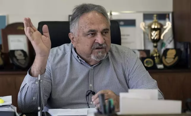 Capt. Mohammed Aziz, advisor to the Middle East Airlines chairman, speaks during an interview with The Associated Press at his office at the MEA headquarter in Beirut, Tuesday, Oct. 22, 2024. (AP Photo/Bilal Hussein)