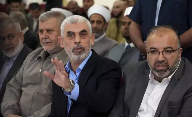 FILE - Yahya Sinwar, head of Hamas in Gaza, greets his supporters upon his arrival at a meeting on the seaside of Gaza City, on April 30, 2022. (AP Photo/Adel Hana, File)