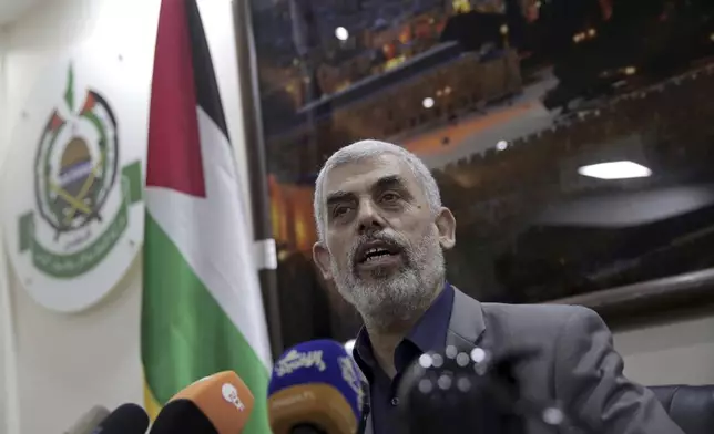 FILE - Yahya Sinwar speaks to foreign correspondents in his office in Gaza City on May 10, 2018. (AP Photo/Khalil Hamra, File)