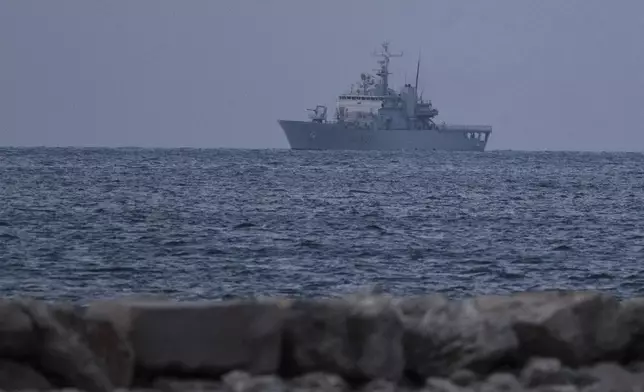 An Italian navy ship approaches the port of Shengjin northwestern Albania Wednesday, Oct. 16, 2024 carrying the first group of migrants who were intercepted in international waters and whose asylum applications will be processed in Albania instead of in Italy, under a five-year agreement between the two countries. (AP Photo/Vlasov Sulaj)