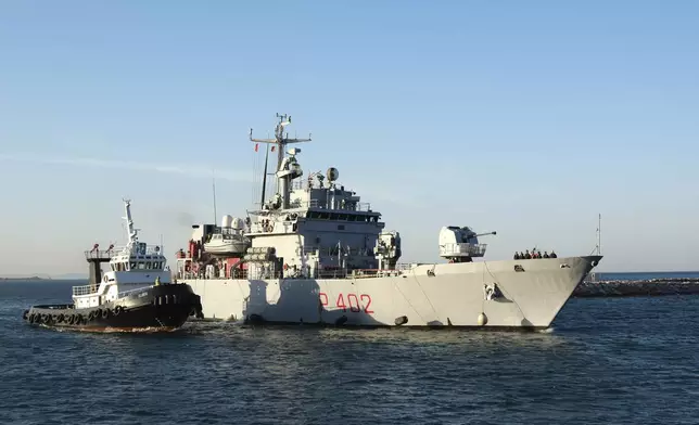 The Italian navy ship Libra arrives at the port of Shengjin northwestern Albania Wednesday, Oct. 16, 2024, carrying the first group of migrants who were intercepted in international waters and redirected to Albania in force of an agreement between the two counties. (AP Photo/Vlasov Sulaj)